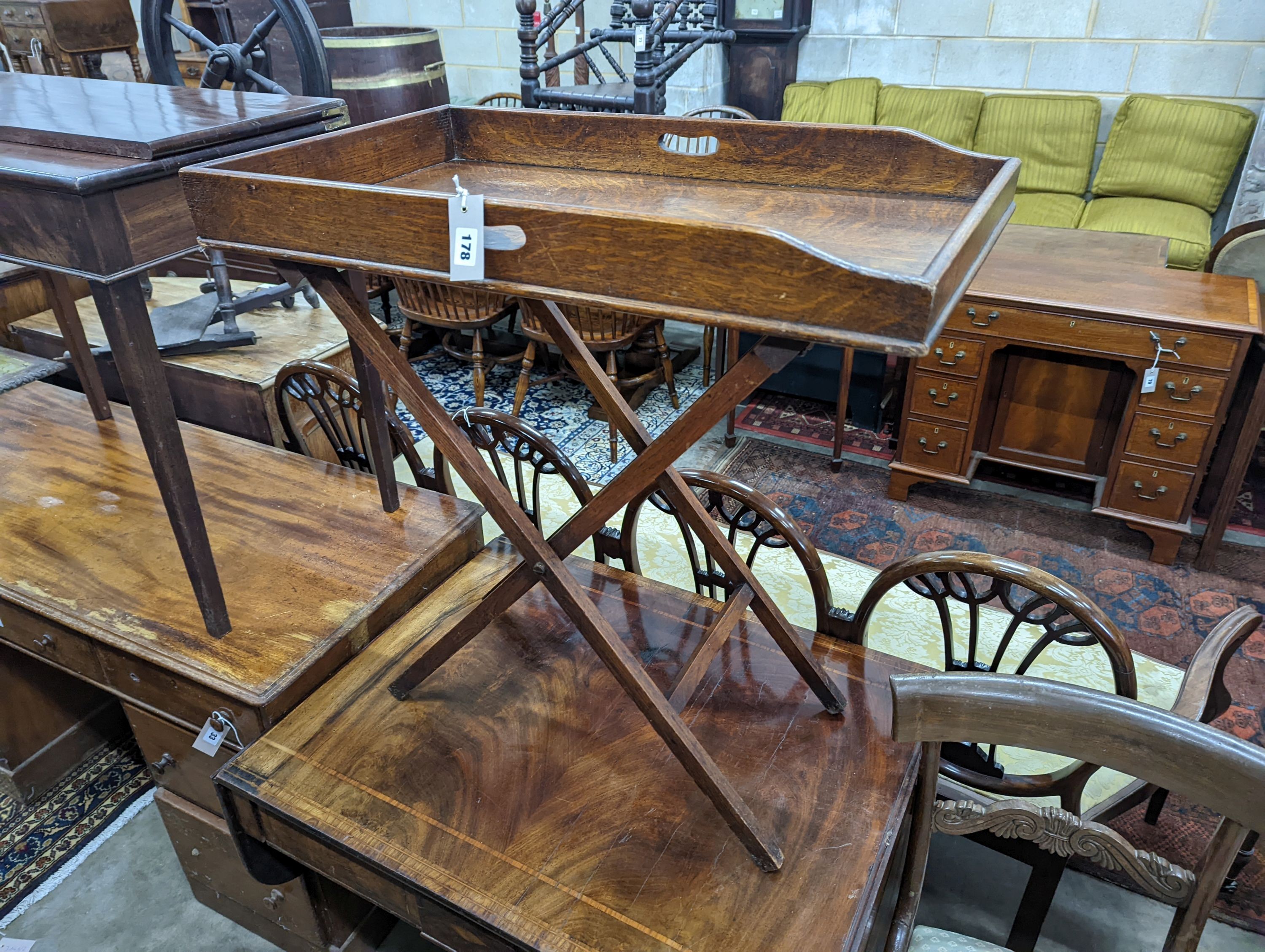 A Victorian rectangular oak butler's tray on folding stand, width 75cm, depth 44cm, height 80cm